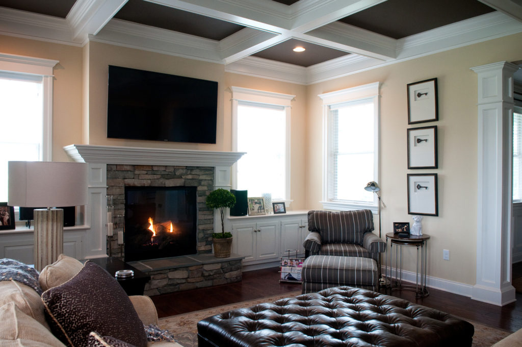 living room with fireplace and coffered ceiling