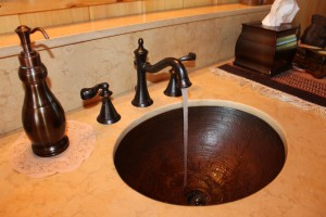 bowl sink with water running