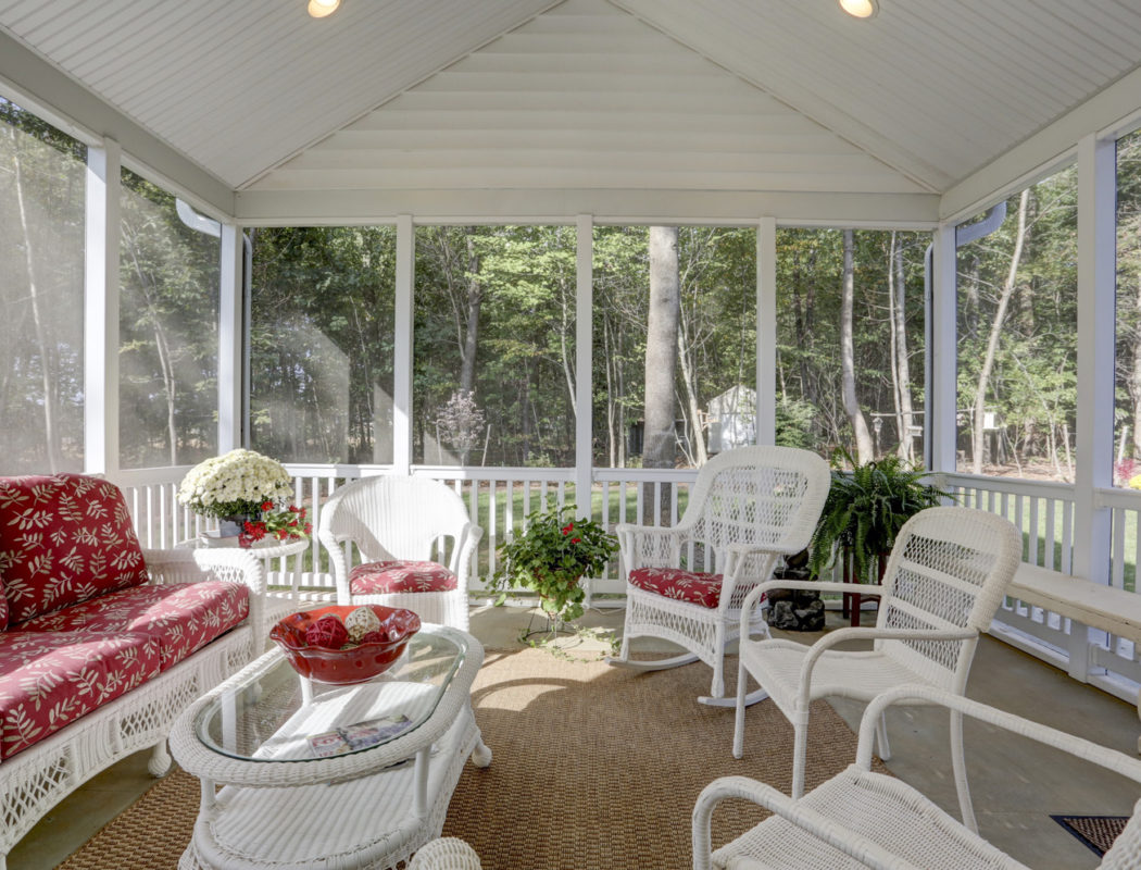 seating area inside of a screened porch