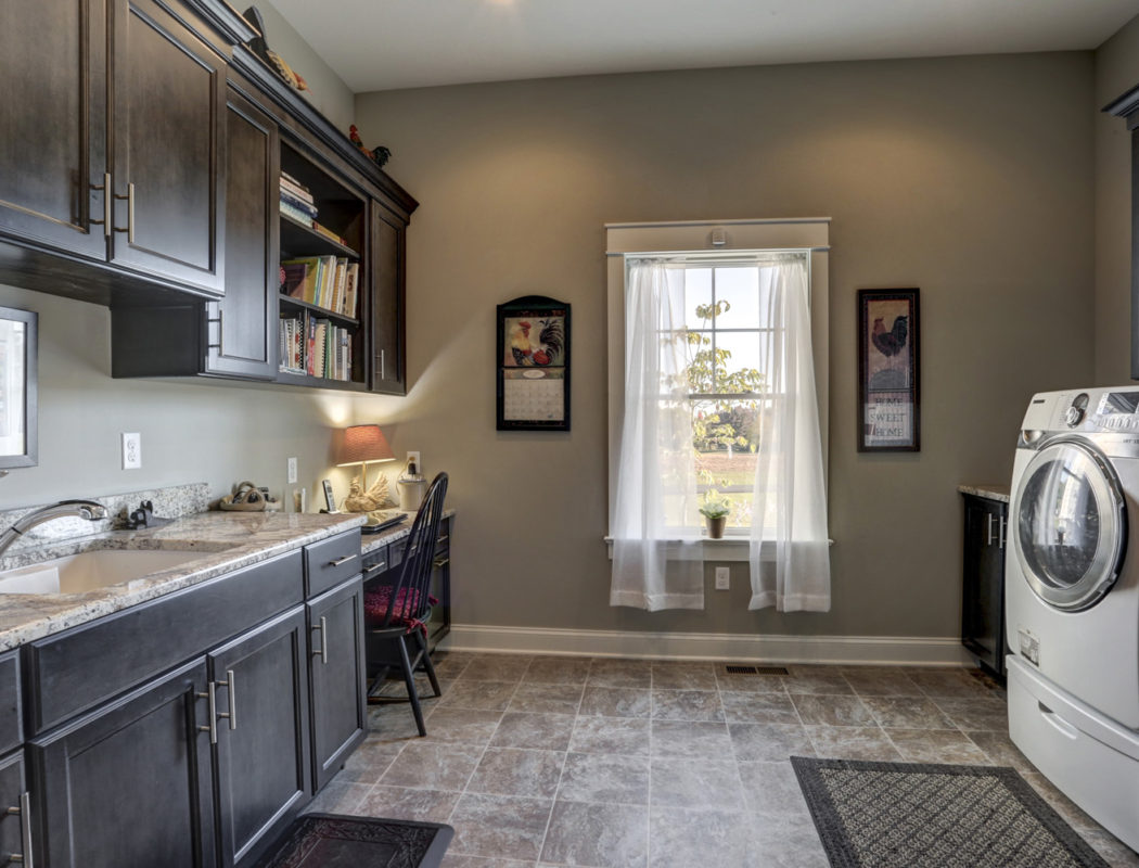 washroom with cabinets and desk