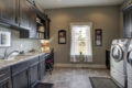 washroom with cabinets and desk