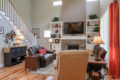 living room with stone fireplace