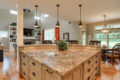 large stone countertop bar area with white drawers underneath