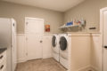 washer and dryer with shelf overhead