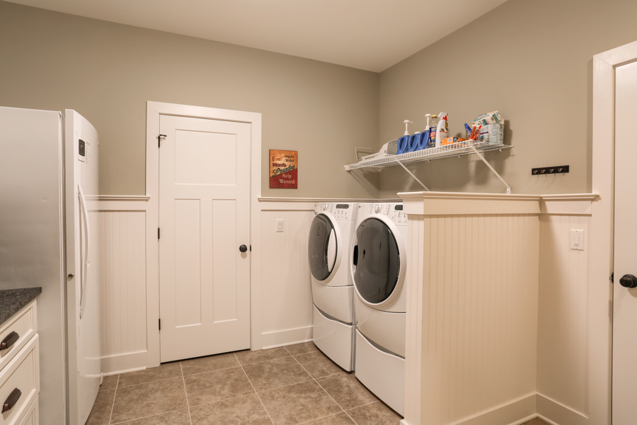washer and dryer with shelf overhead