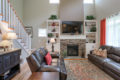 living room with stone fireplace