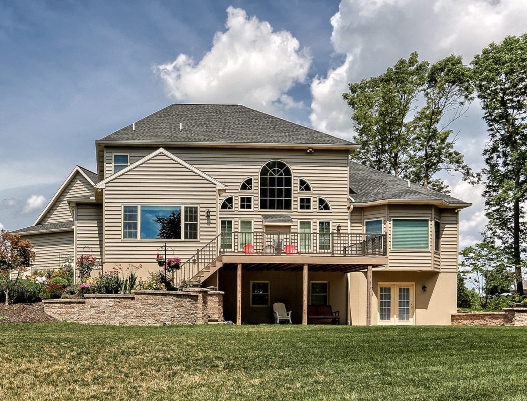 the back of a home with a deck