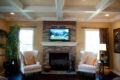 living room with stone fireplace