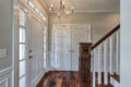 custom home entryway and wood railing for staircase