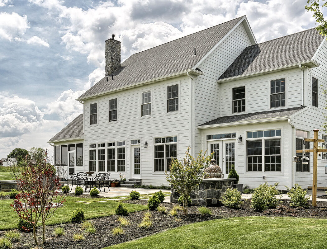 country farmhouse exterior rear patio and landscaping