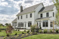 country farmhouse exterior rear patio and landscaping