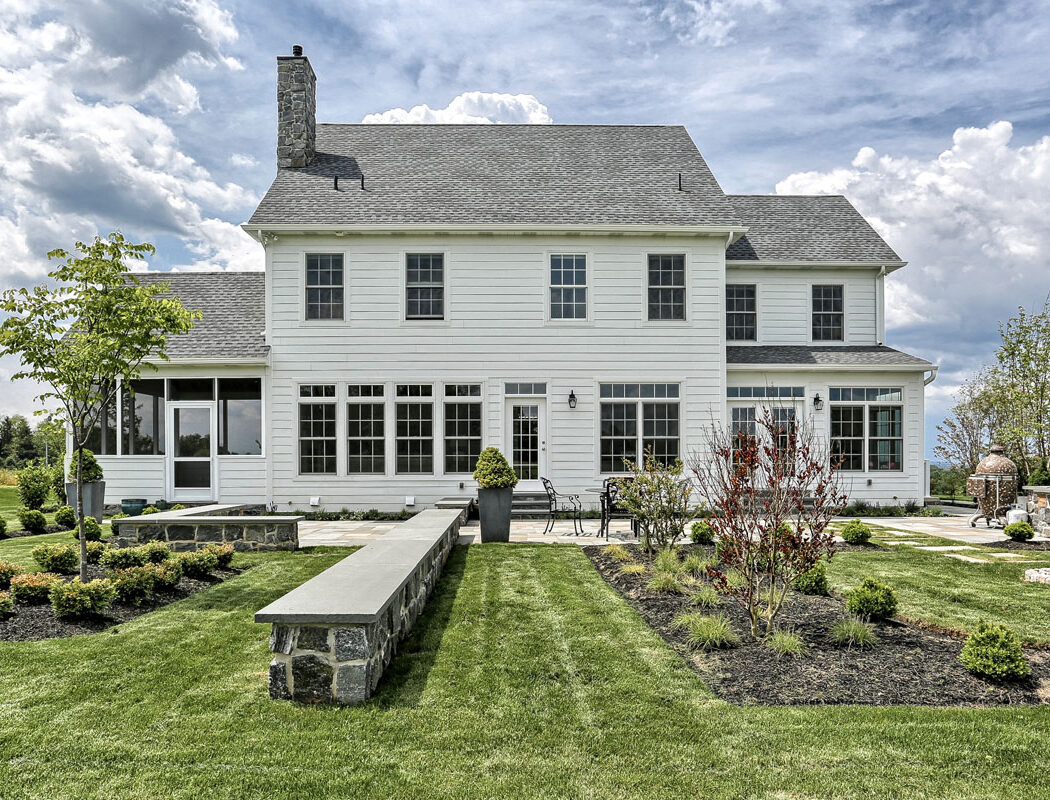 country farmhouse exterior rear patio and landscaping