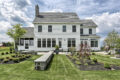 country farmhouse exterior rear patio and landscaping