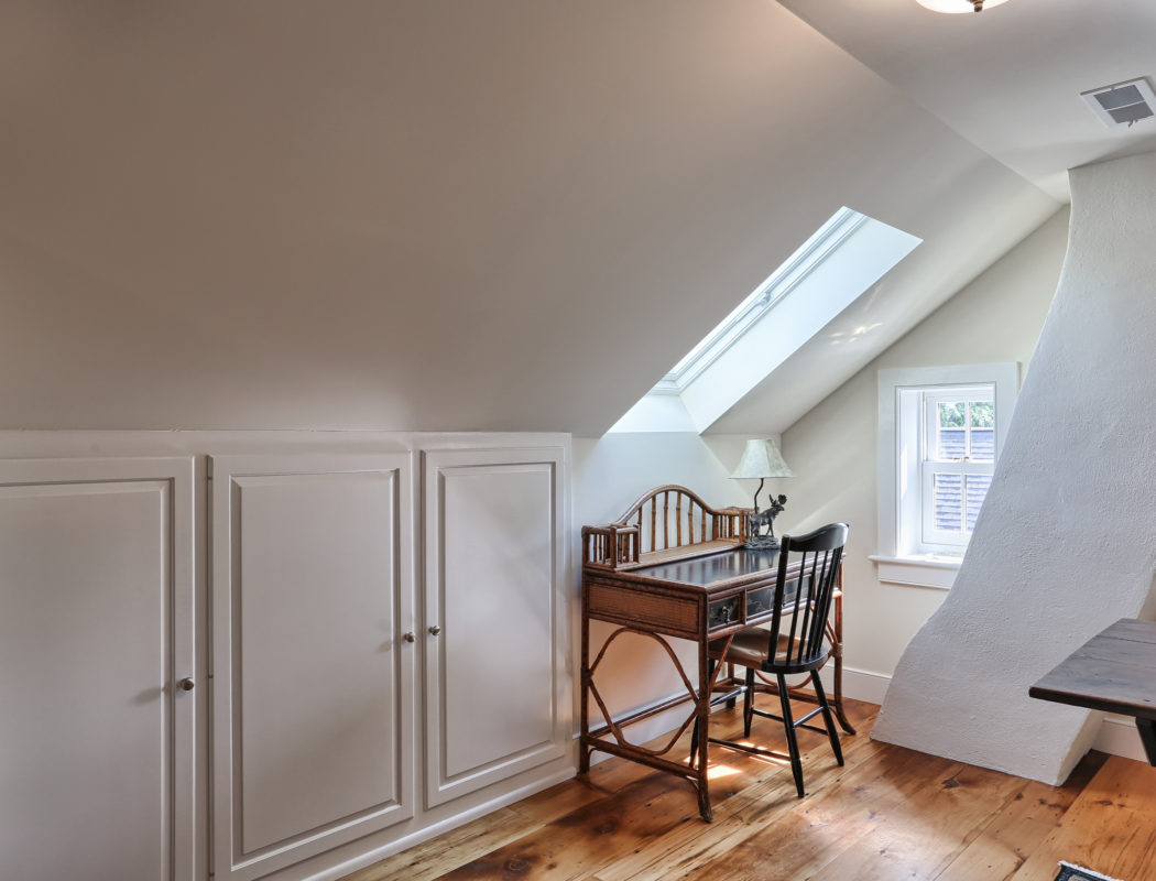 attic area with desk