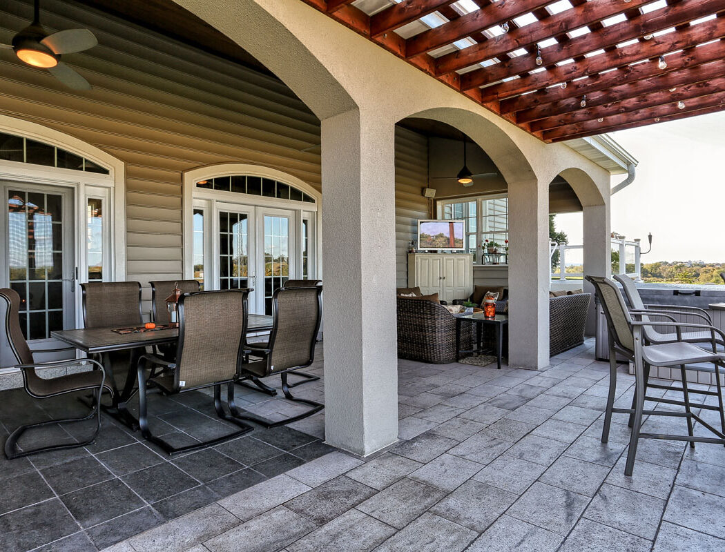 outdoor living area with furniture, a shade structure, and hardscaped patio