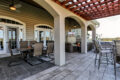 outdoor living area with furniture, a shade structure, and hardscaped patio