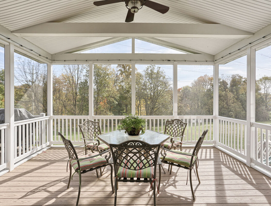 small patio set on a screened in porch