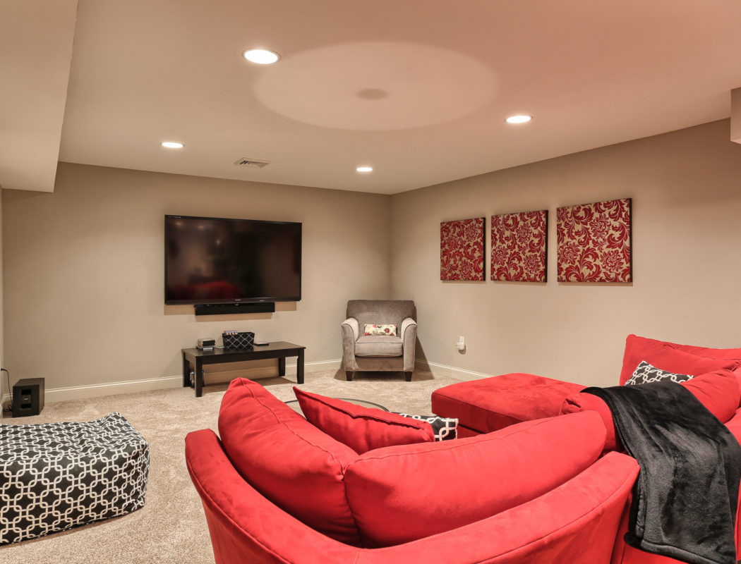 couch and TV area of a recently renovated basement