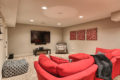 couch and TV area of a recently renovated basement