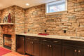 stone wall above kitchen countertops