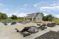 outdoor patio area surrounding a pool