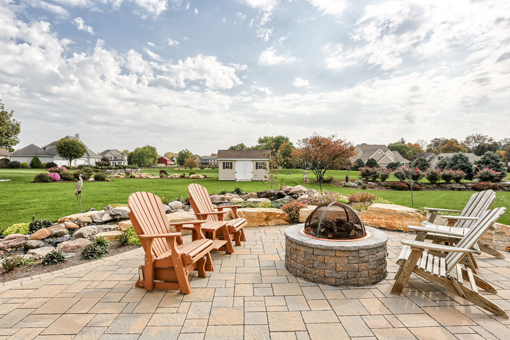 hardscaped patio area with seating and firepit