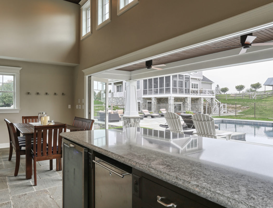 bar and dining area inside a pool house