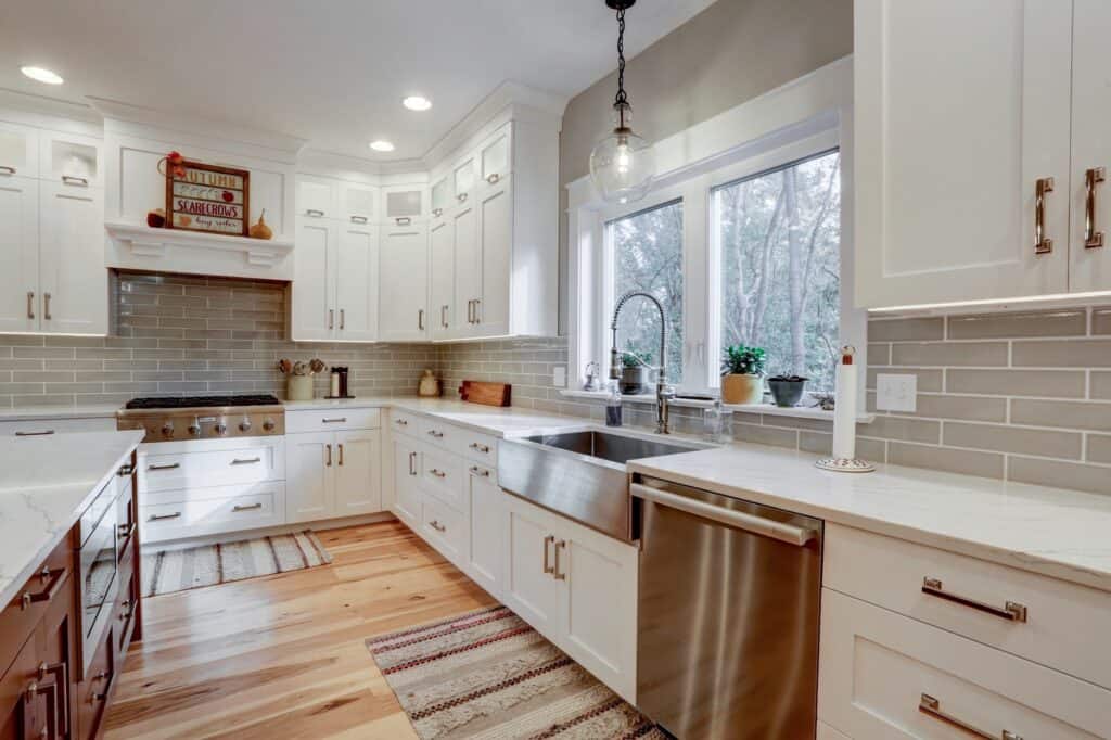 spacious kitchen with white cabinetry