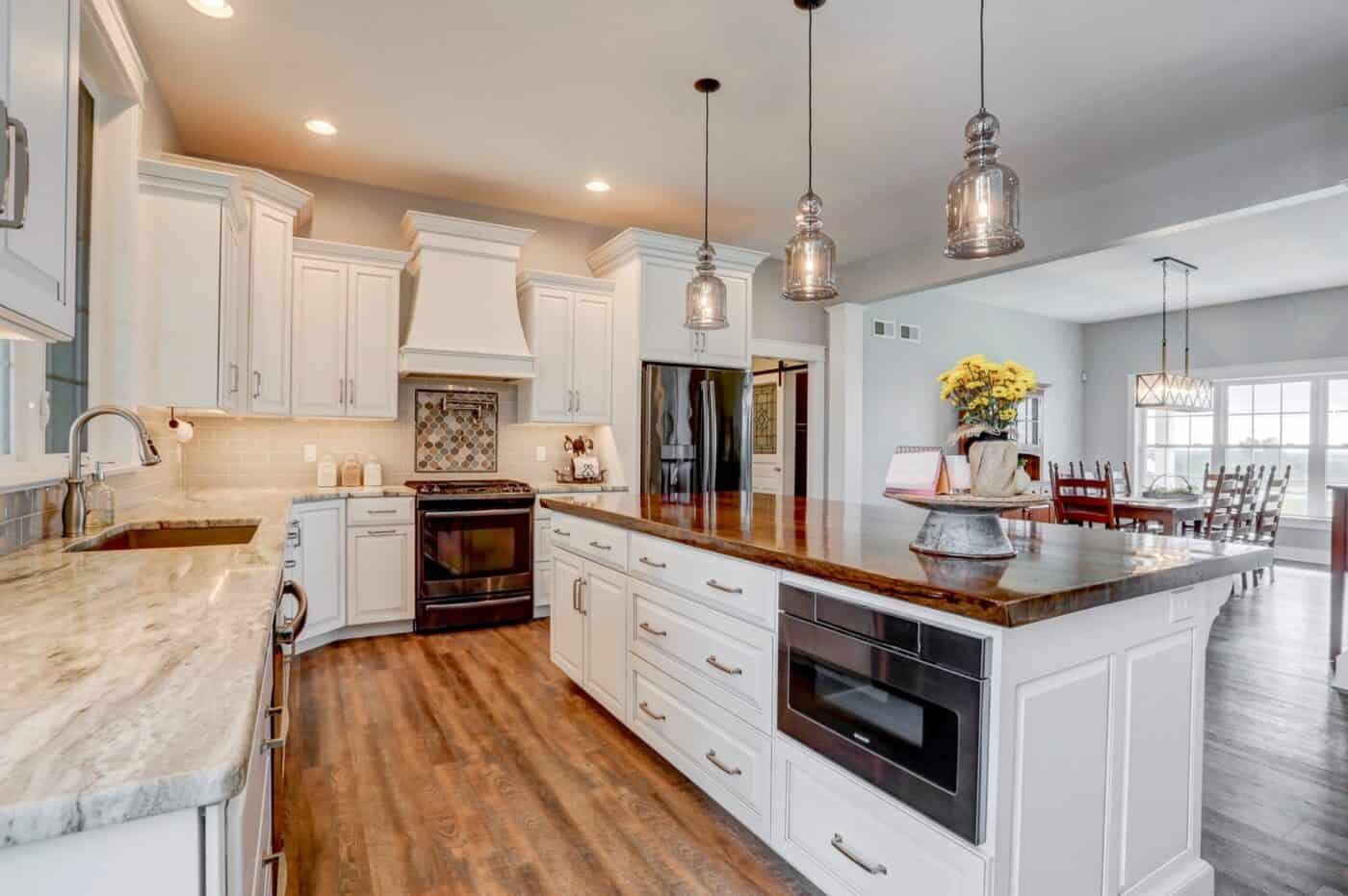 large kitchen with white cabinetry